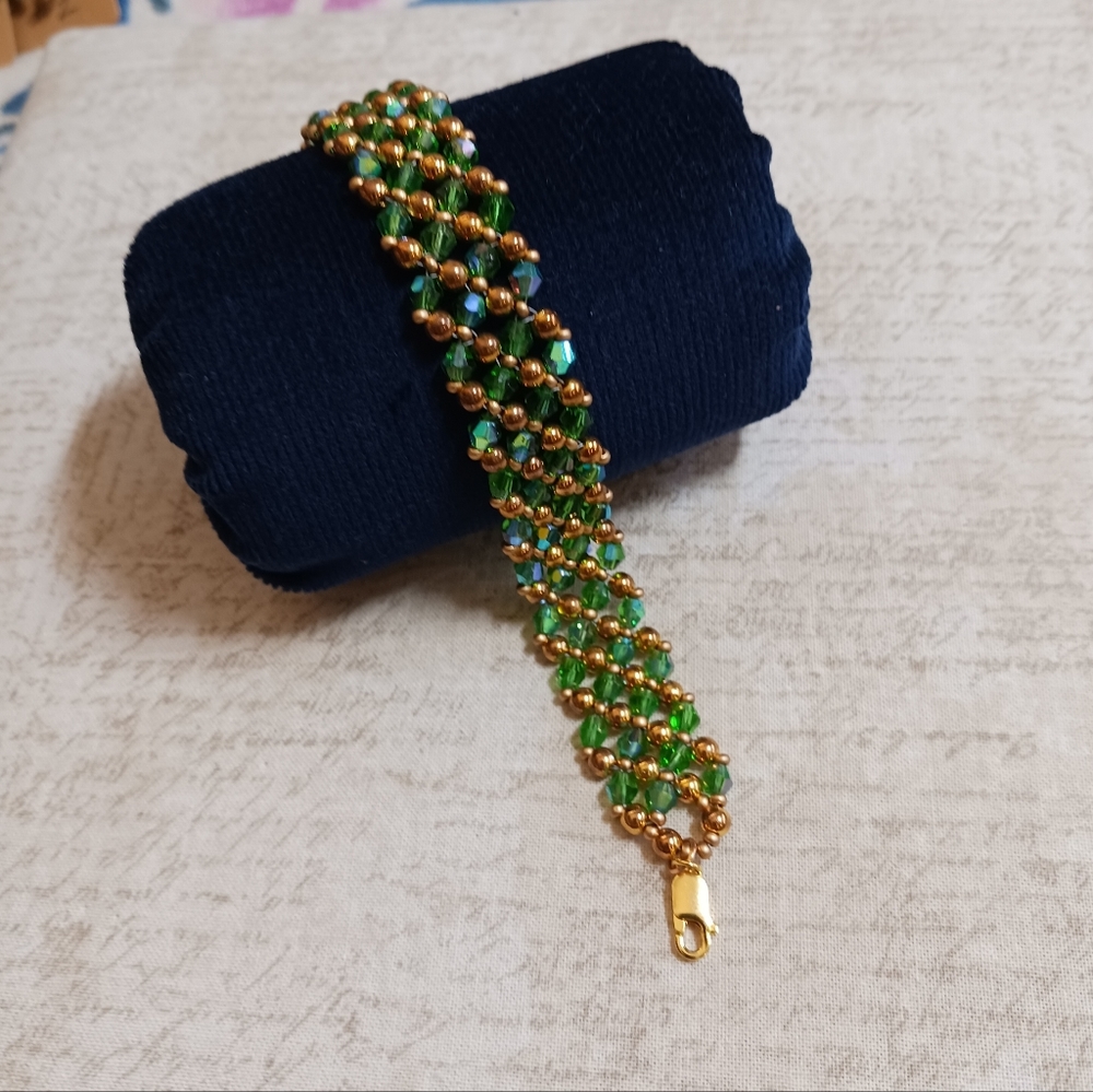 New, Crystal bracelet Green and gold, 7.25+inches, gold plated lobster claw clsp